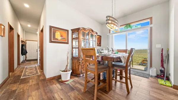 a bed room with two beds and a large window