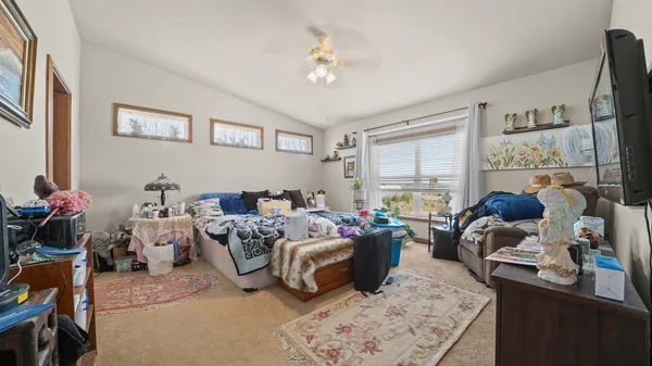 a kitchen with stainless steel appliances granite countertop a refrigerator a sink and wooden cabinets