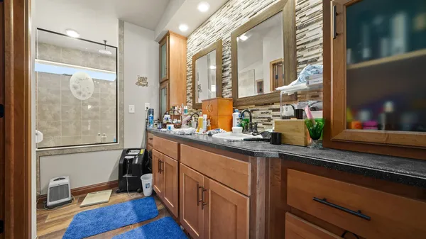 a bathroom with a sink toilet and shower