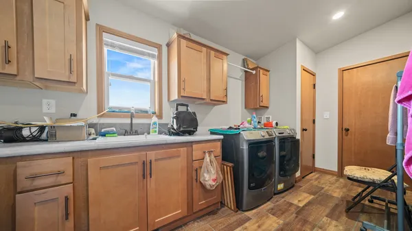 a bedroom with a bed and large windows