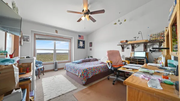 a bathroom with a sink a toilet and a shower curtain