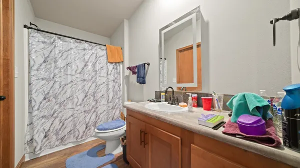 a room with furniture a chandelier and a window