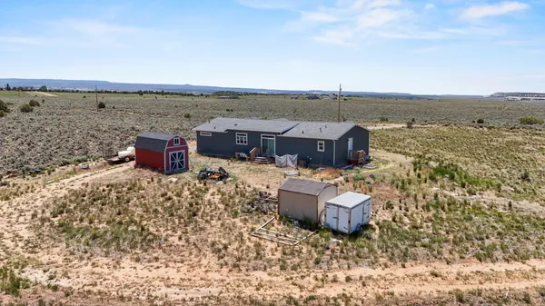 a view of a balcony with furniture and wooden floor