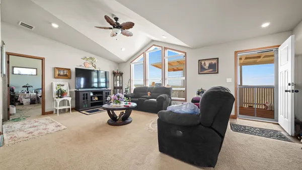 a living room with furniture fireplace and window