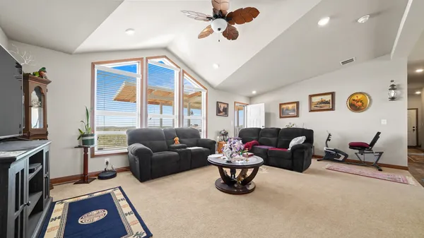 a living room with furniture and a window