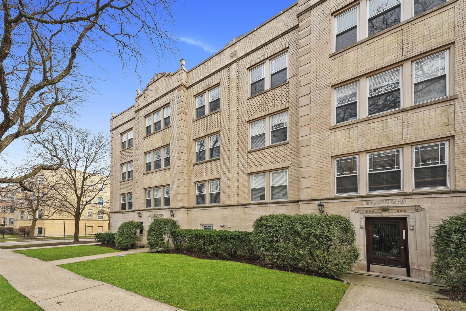 800 Dobson Street, Unit 3 Evanston, IL 60202 - Photo 25 of 26 a view of a building with a yard