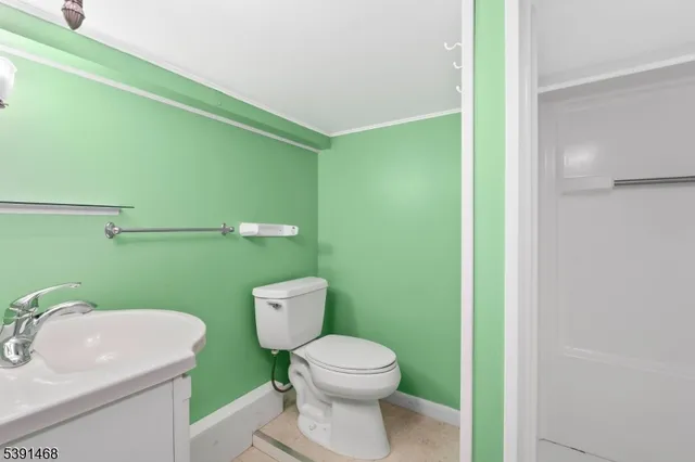 a bathroom with a toilet and a sink