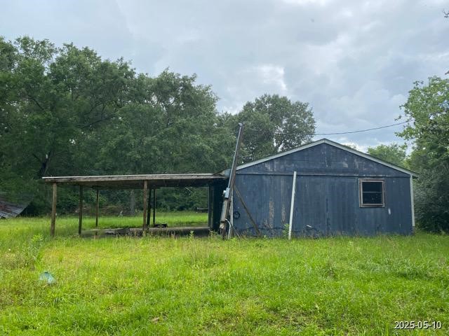 201 West Oak Daisetta, TX 77533 - Photo 2 of 6 a view of backyard with wooden fence