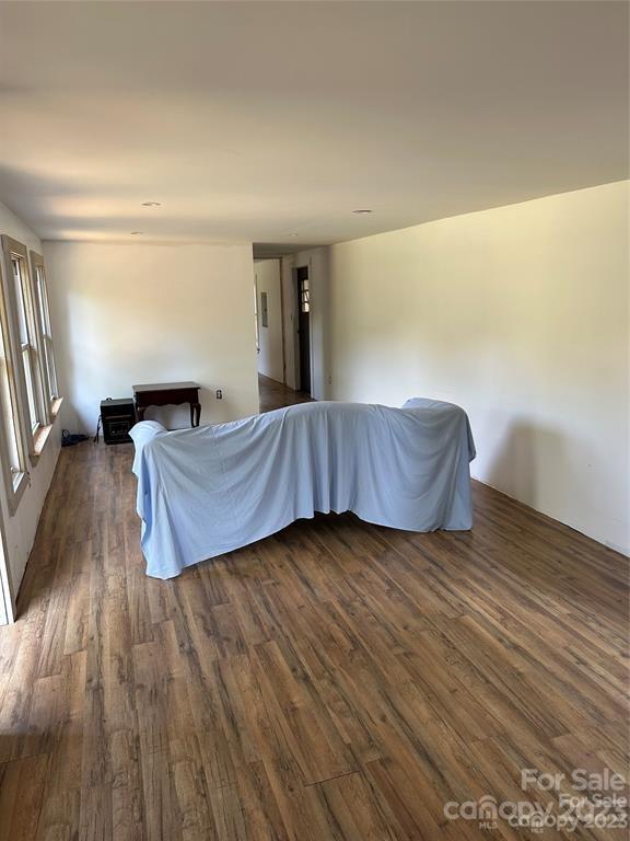 1385 Rock Spring Road Mill Spring, NC 28756 - Photo 10 of 15 a living room with hard wood floors and a couch