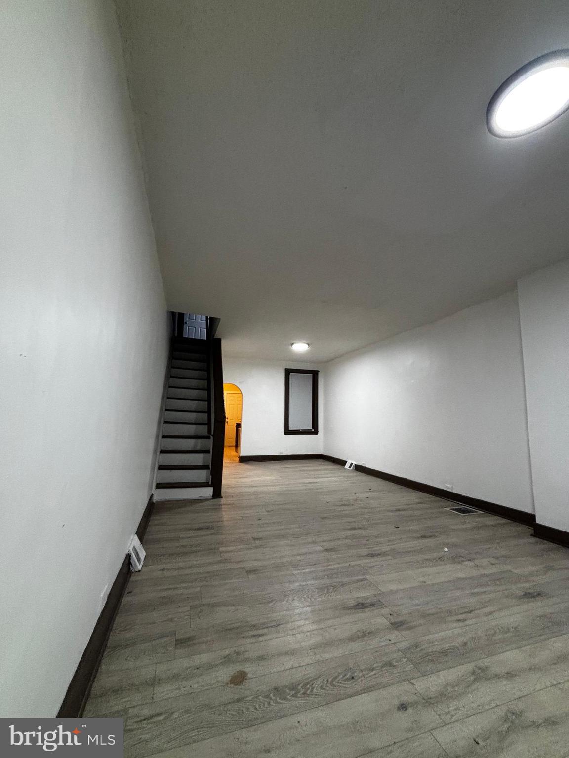 2116 East Cambria Street Philadelphia, PA 19134 - Photo 2 of 9 a view of a room with wooden floor and stairs