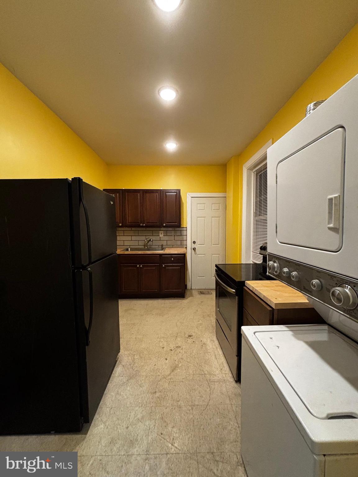 2116 East Cambria Street Philadelphia, PA 19134 - Photo 4 of 9 a kitchen with a sink and a refrigerator