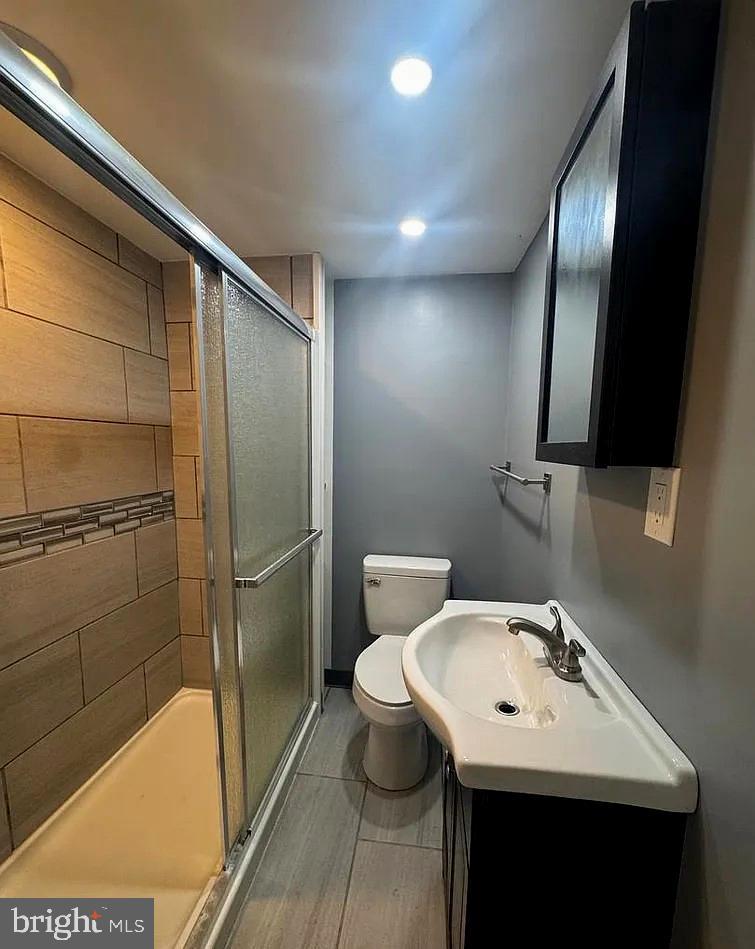 2116 East Cambria Street Philadelphia, PA 19134 - Photo 8 of 9 a bathroom with a sink toilet and shower
