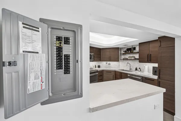 a kitchen with stainless steel appliances a refrigerator and a stove top oven