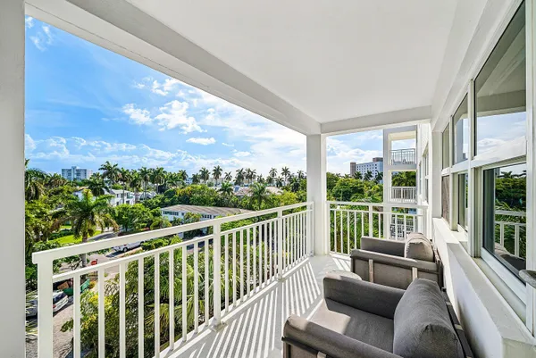 a balcony with furniture