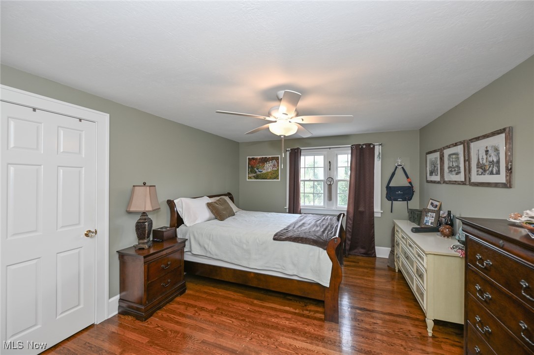 8960 Avery Road Broadview Heights, OH 44147 - Photo 30 of 50 Bedroom featuring ceiling fan, dark wood flooring