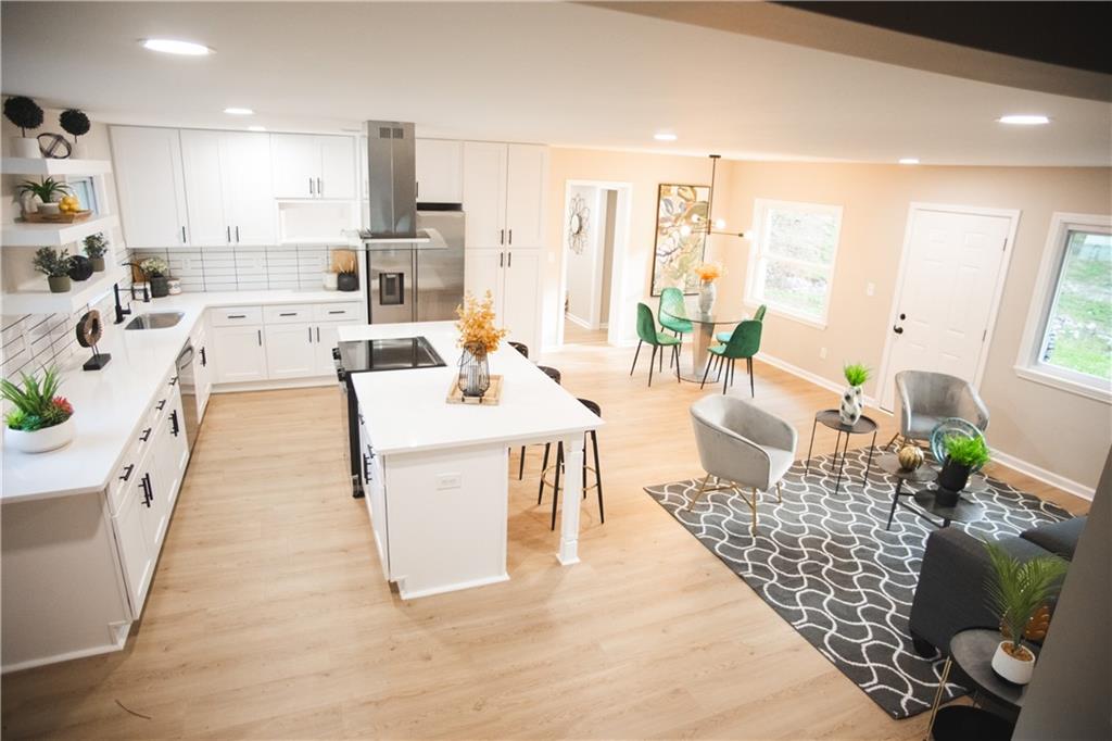 3561 Misty Valley Road Decatur, GA 30032 - Photo 11 of 56 a living room with furniture wooden floor and a table
