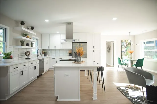 a kitchen with a sink and a stove