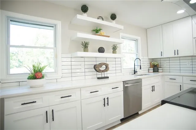a kitchen with a sink and a window
