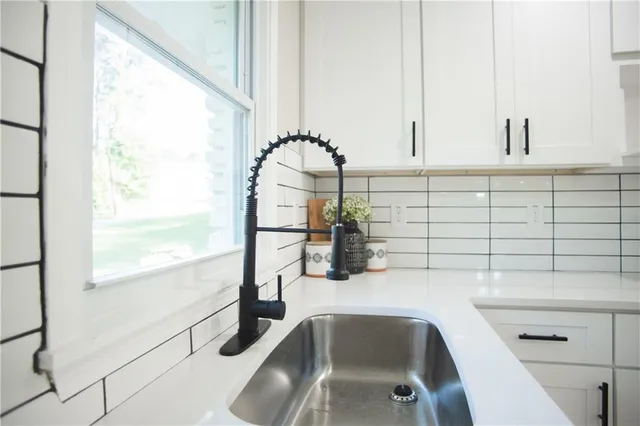 a dining room with furniture and chandelier