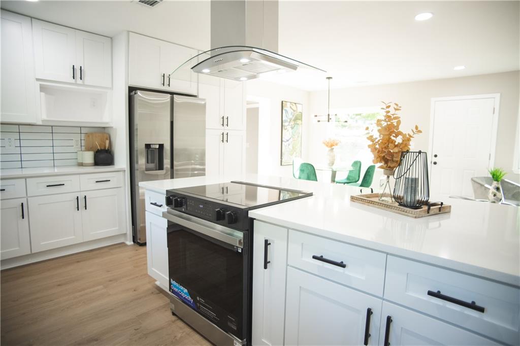 3561 Misty Valley Road Decatur, GA 30032 - Photo 26 of 56 a kitchen with a sink and cabinets