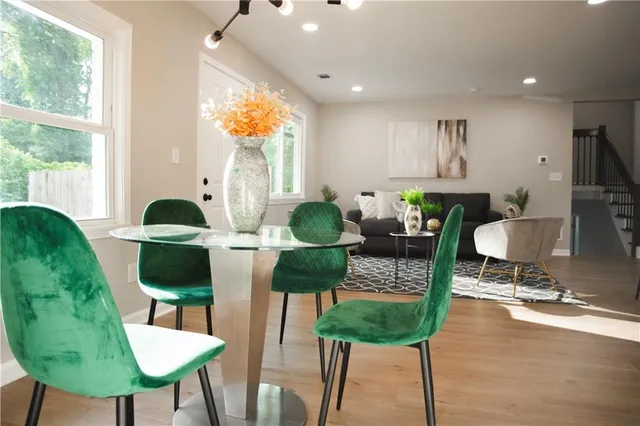 a living room with a couch and a potted plant