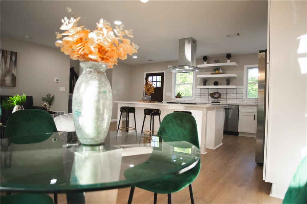 3561 Misty Valley Road Decatur, GA 30032 - Photo 30 of 56 a dining room with furniture and chandelier