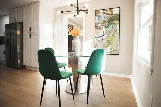 a view of a room that has a table and chair