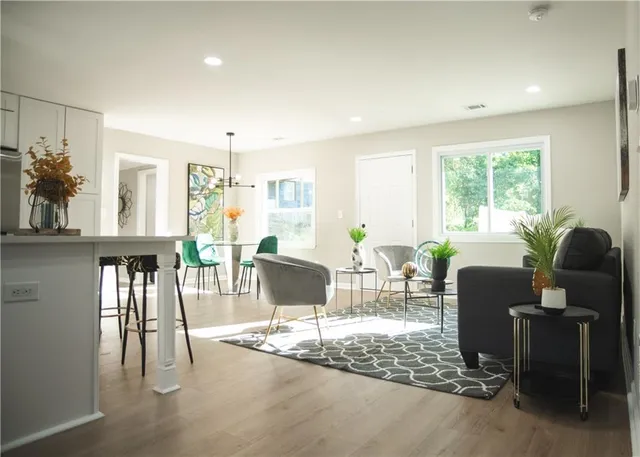 a view of a livingroom with furniture and wooden floor