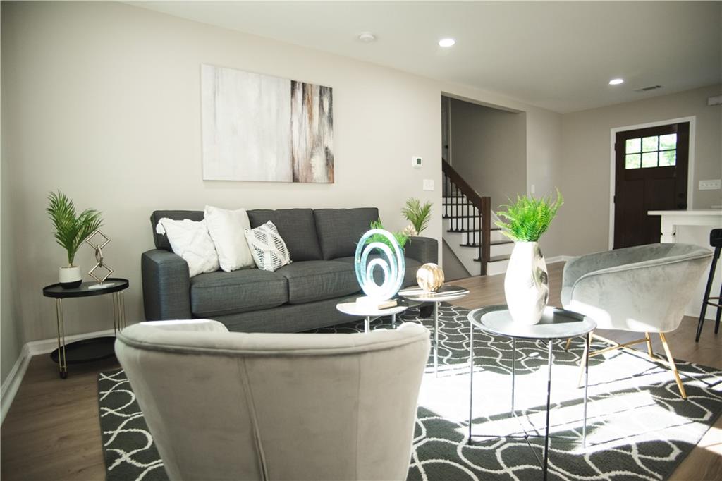 3561 Misty Valley Road Decatur, GA 30032 - Photo 35 of 56 a living room with furniture and wooden floor