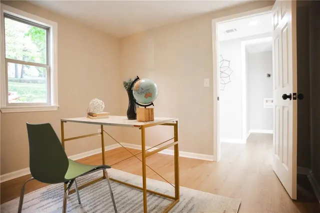 a view of front door with wooden floor