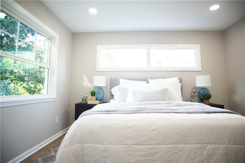 3561 Misty Valley Road Decatur, GA 30032 - Photo 48 of 56 a large white bed in a bedroom next to a window