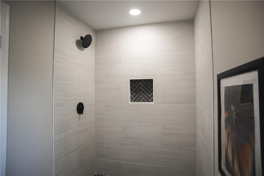 3561 Misty Valley Road Decatur, GA 30032 - Photo 55 of 56 a bathroom with a shower and a toilet