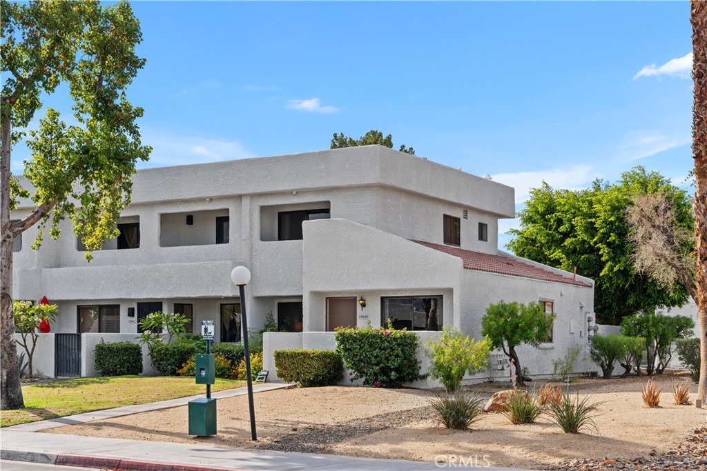 69646 Antonia Way Rancho Mirage, CA 92270 - Photo 4 of 50 a view of a white house with a outdoor space