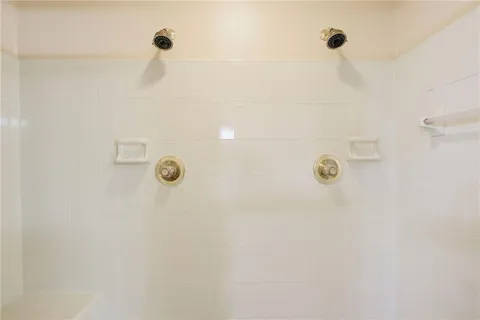 a view of an empty room and wooden floor