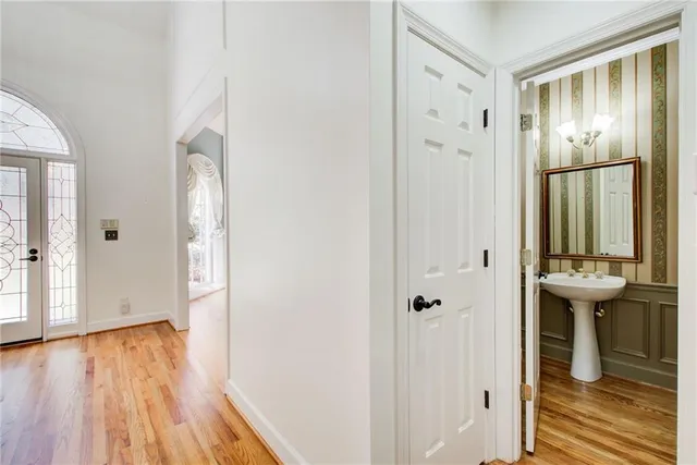 an empty room with windows and closet