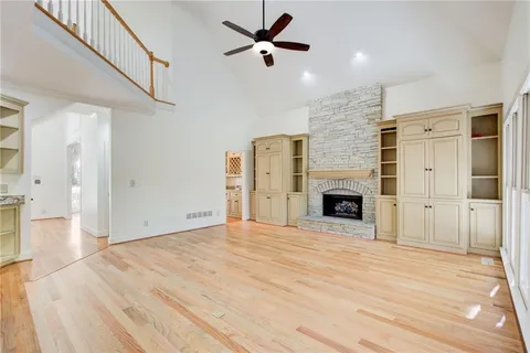 a bathroom with a shower a toilet and a sink