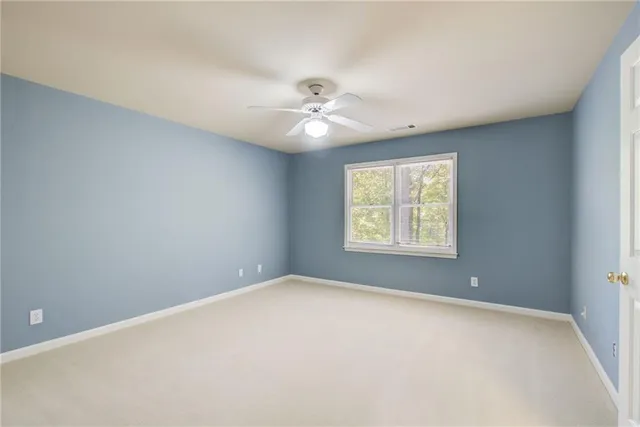 a view of a room with wooden floor and chandelier