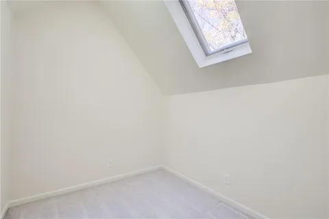 a view of a blue house with a large space