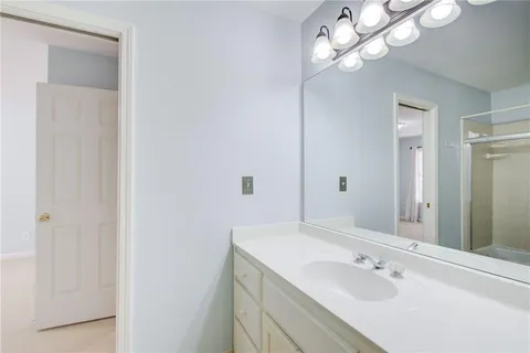 a view of swimming pool and trees in the background