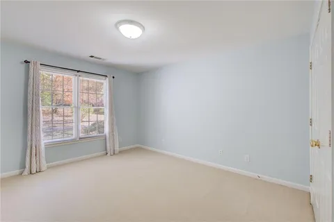 front view of a house with a small yard