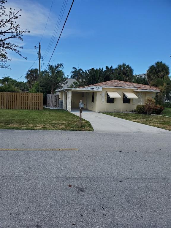 608 South Riverside Drive Pompano Beach, FL 33062 - Photo 2 of 7 a view of backyard of house and green space