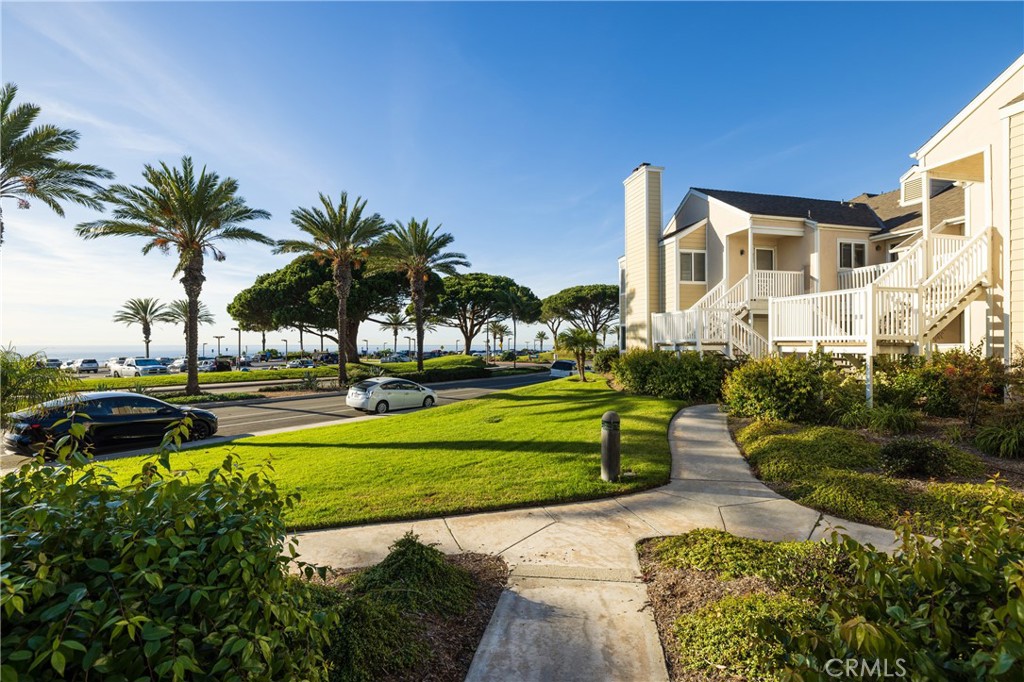 34116 Selva Road, Unit 309 Dana Point, CA 92629 - Photo 1 of 1 a view of a house with a yard