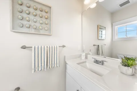 a bed room with a bed and a large window