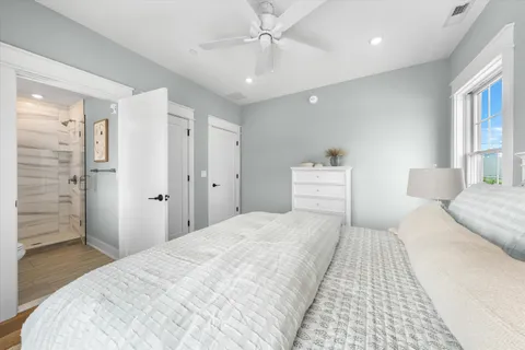 a bathroom with a sink vanity mirror and shower