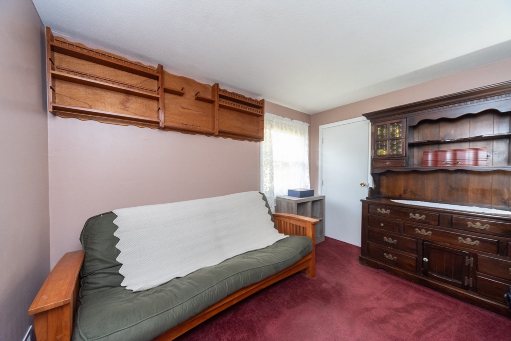 221 Sinclair Road Brockton, MA 02302 - Photo 14 of 26 a living room with furniture and a flat screen tv