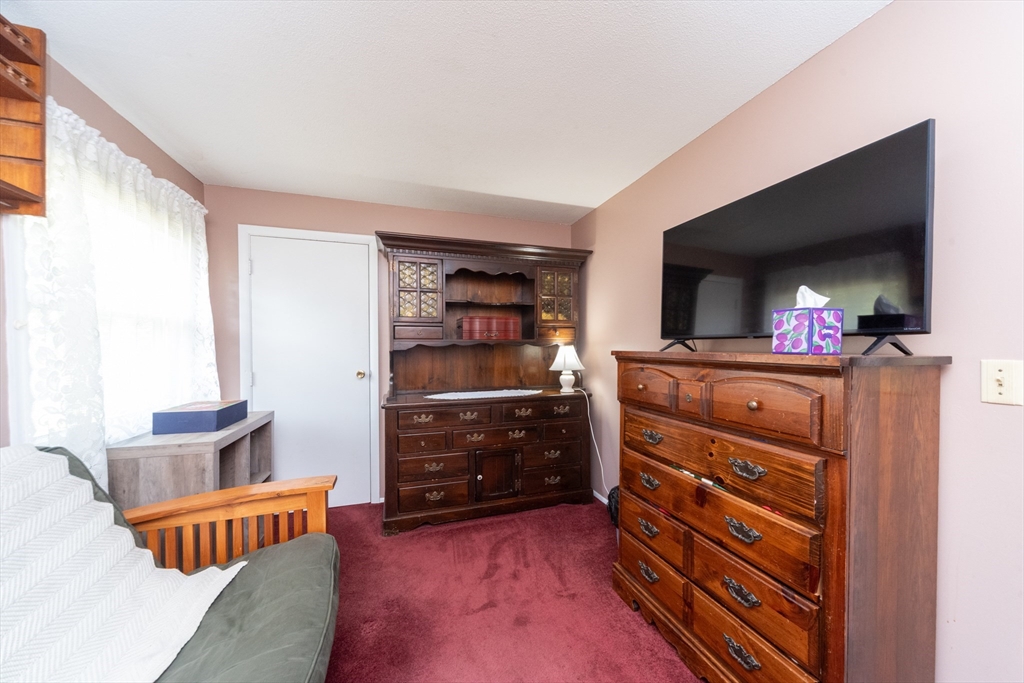 221 Sinclair Road Brockton, MA 02302 - Photo 15 of 26 a room with furniture and a dresser
