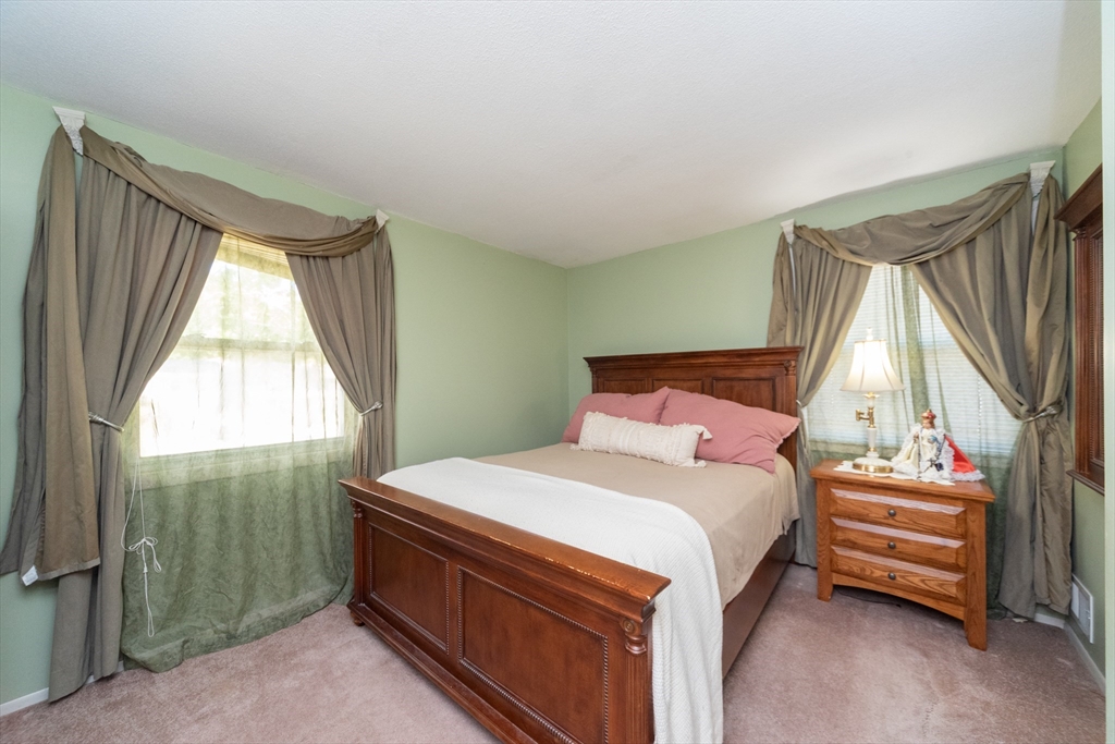 221 Sinclair Road Brockton, MA 02302 - Photo 19 of 26 a bedroom with a bed and a window