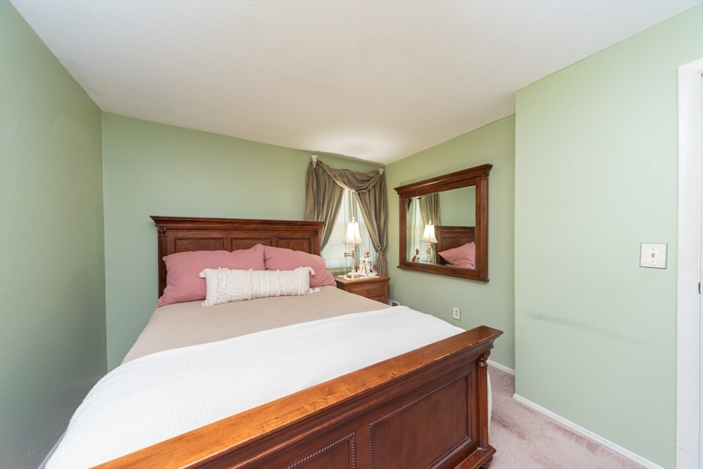 221 Sinclair Road Brockton, MA 02302 - Photo 20 of 26 a bedroom with a bed and a window