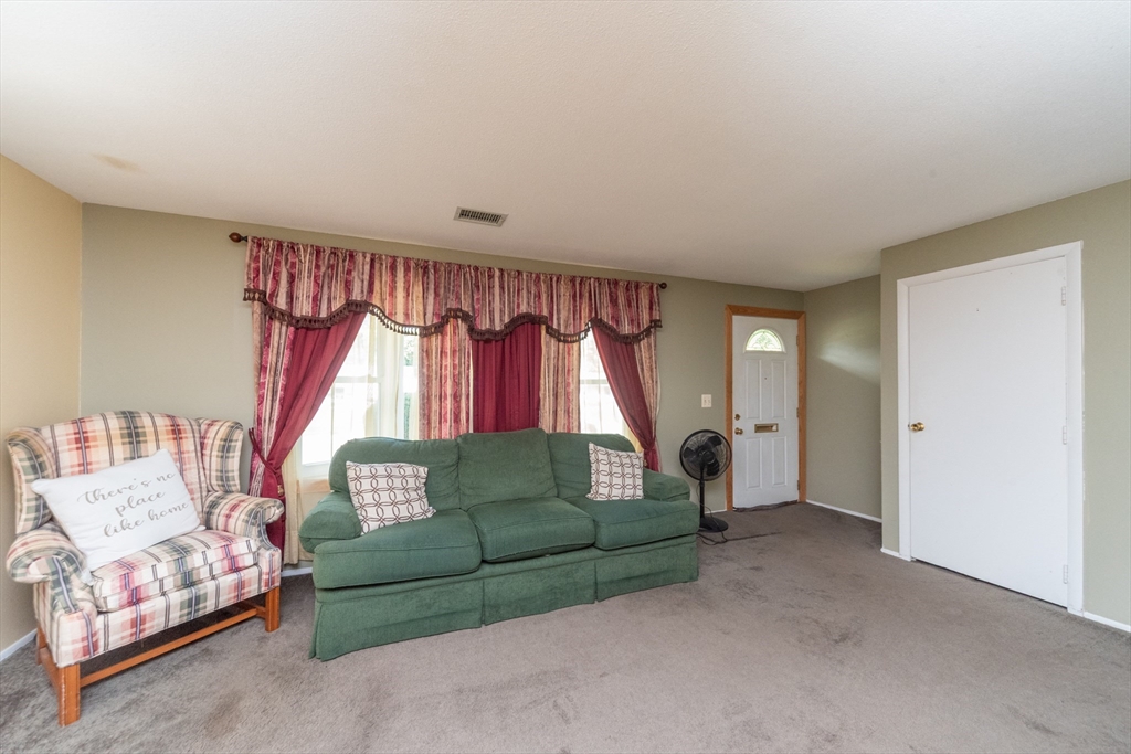 221 Sinclair Road Brockton, MA 02302 - Photo 4 of 26 a living room with furniture and a window