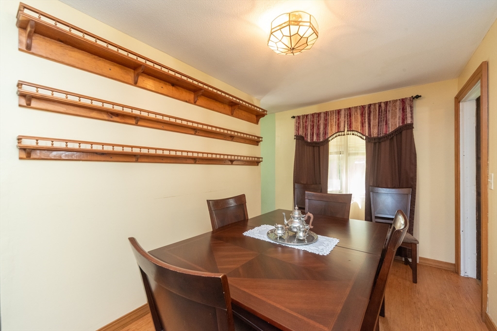 221 Sinclair Road Brockton, MA 02302 - Photo 6 of 26 a view of a dining room with furniture and a chandelier